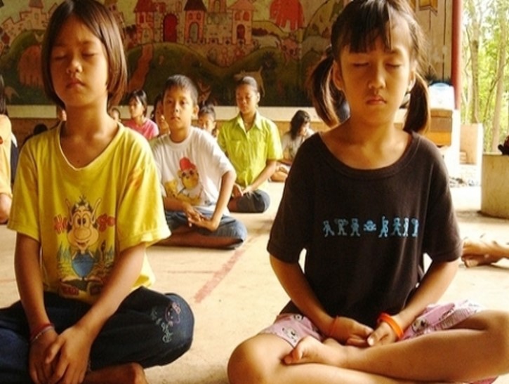 photo of students sitting and being mindful
