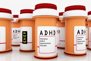 Several medicine bottles with ADHD on their labels